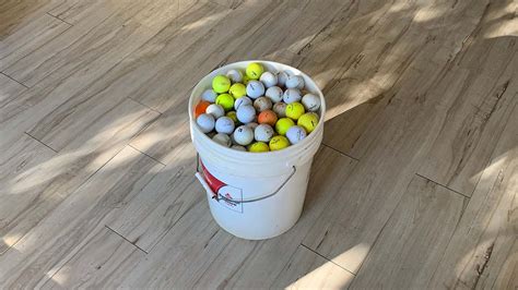 How Many Golf Balls Fit in a 5 Gallon Bucket, and Why Do Cats Always Land on Their Feet?